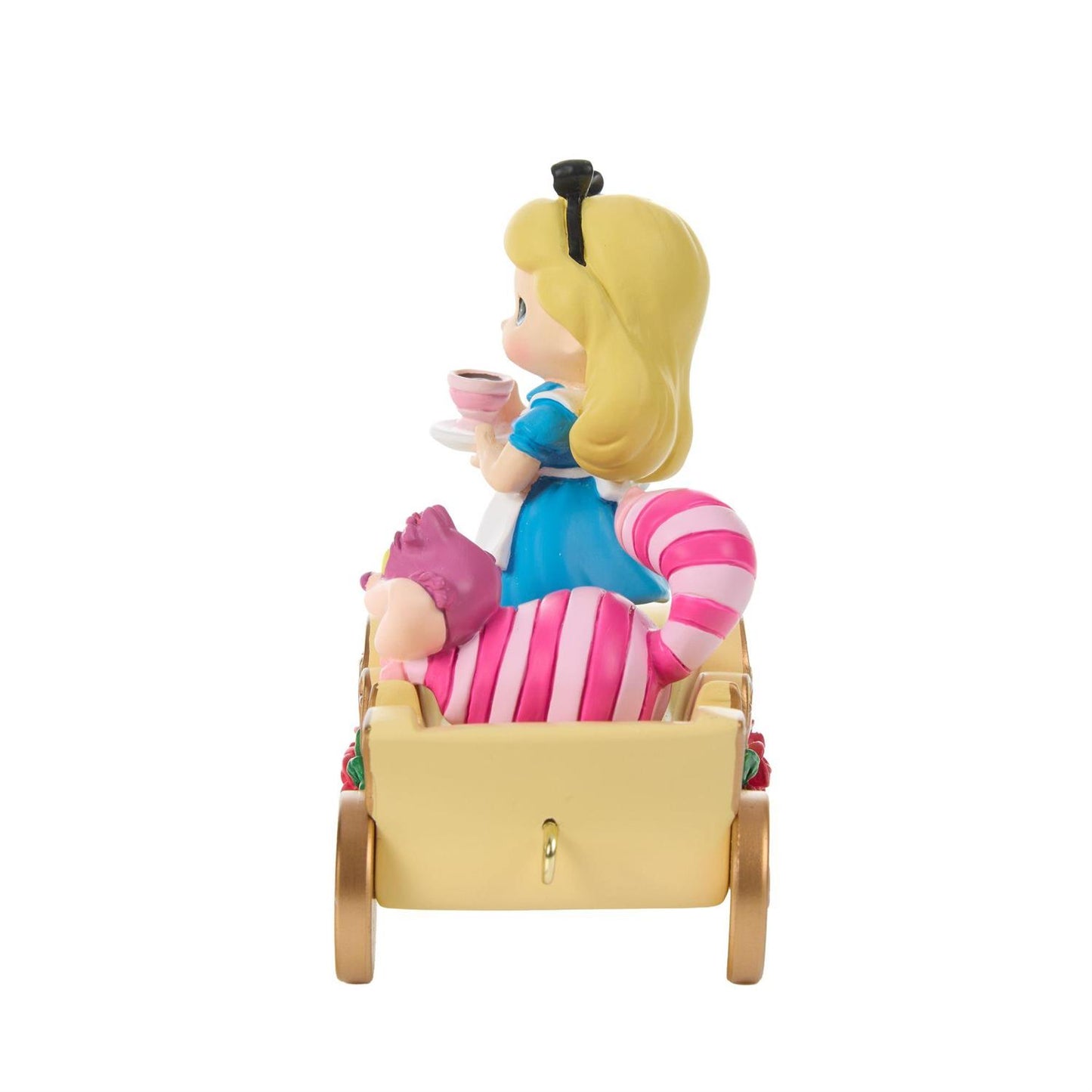 Alice holding a Tea Cup and the Cheshire Cat riding in a Birthday Train Car
