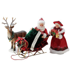 Buy Possible Dreams at CountryNMoreGifts.com Santa and Mrs Claus filling the Sleigh as a Reindeer watches