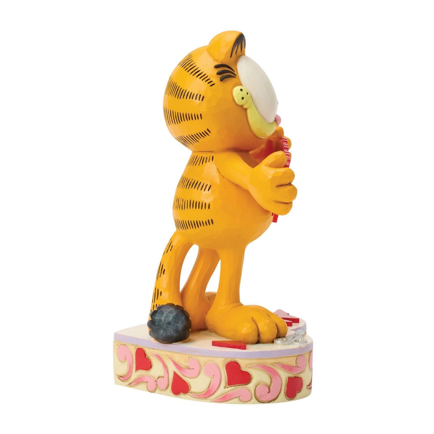 Garfield standing on a heart podium holding a string of hearts