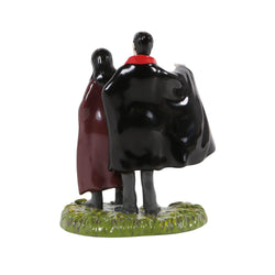 Buy Department 56 Figurine of a man and woman in vampire costumes with red cloaks from CountryNMoreGifts.com