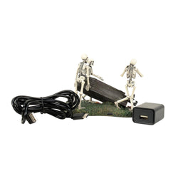 Buy Department 56 Halloween-themed decorative scene with skeletons and a coffin from CountryNMoreGifts.com
