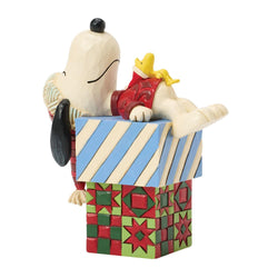 Buy Jim Shore at CountryNMoreGifts.com Snoopy and Woodstock laying on a Stack of Presents