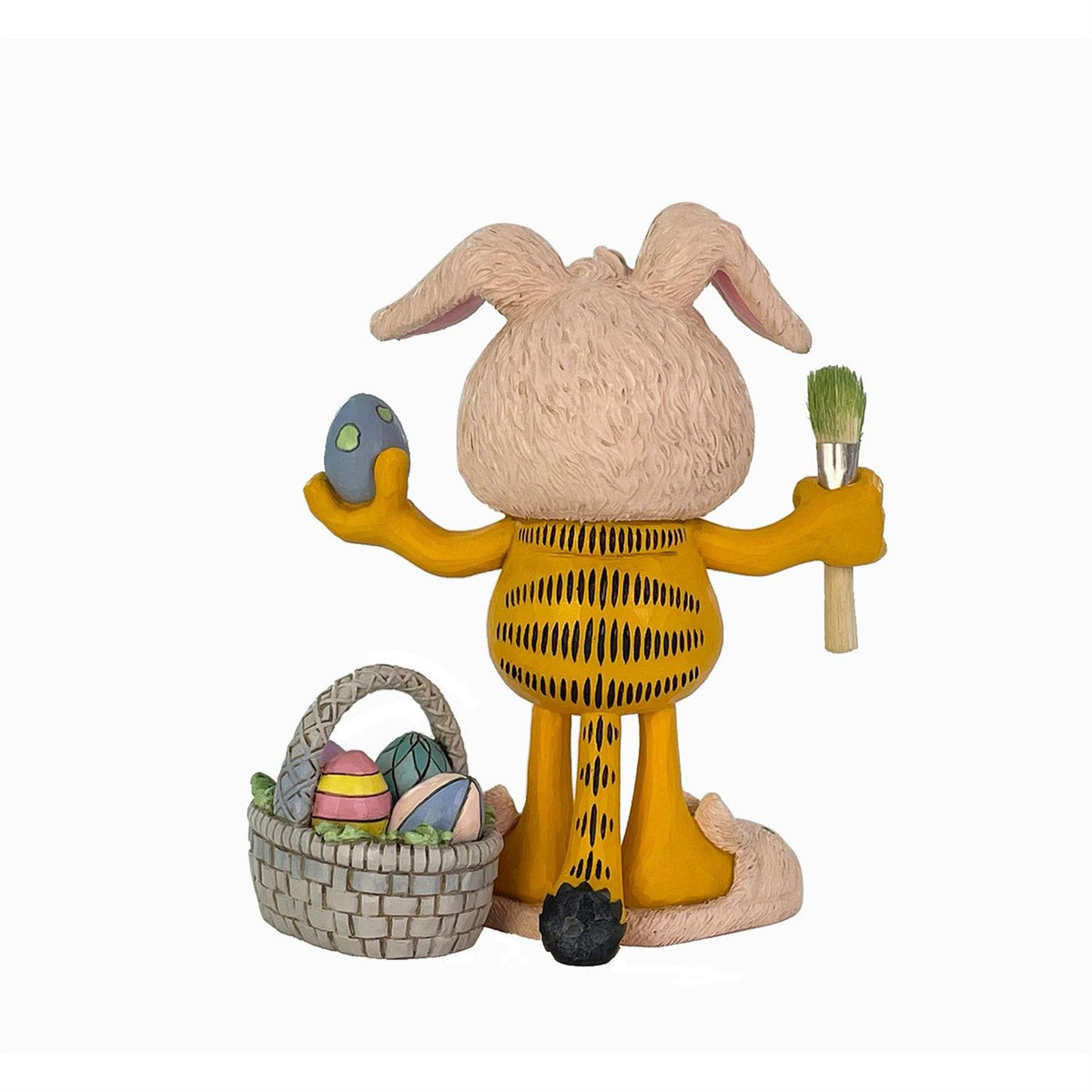 Garfield wearing bunny ears, bunny slippers and decorating easter eggs