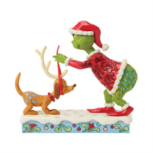 Grinch Tying Antlers to Max Figurine