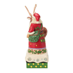 Buy Jim Shore at CountryNMoreGifts.com Santa standing next to a Reindeer wearing a John Deere Blanket