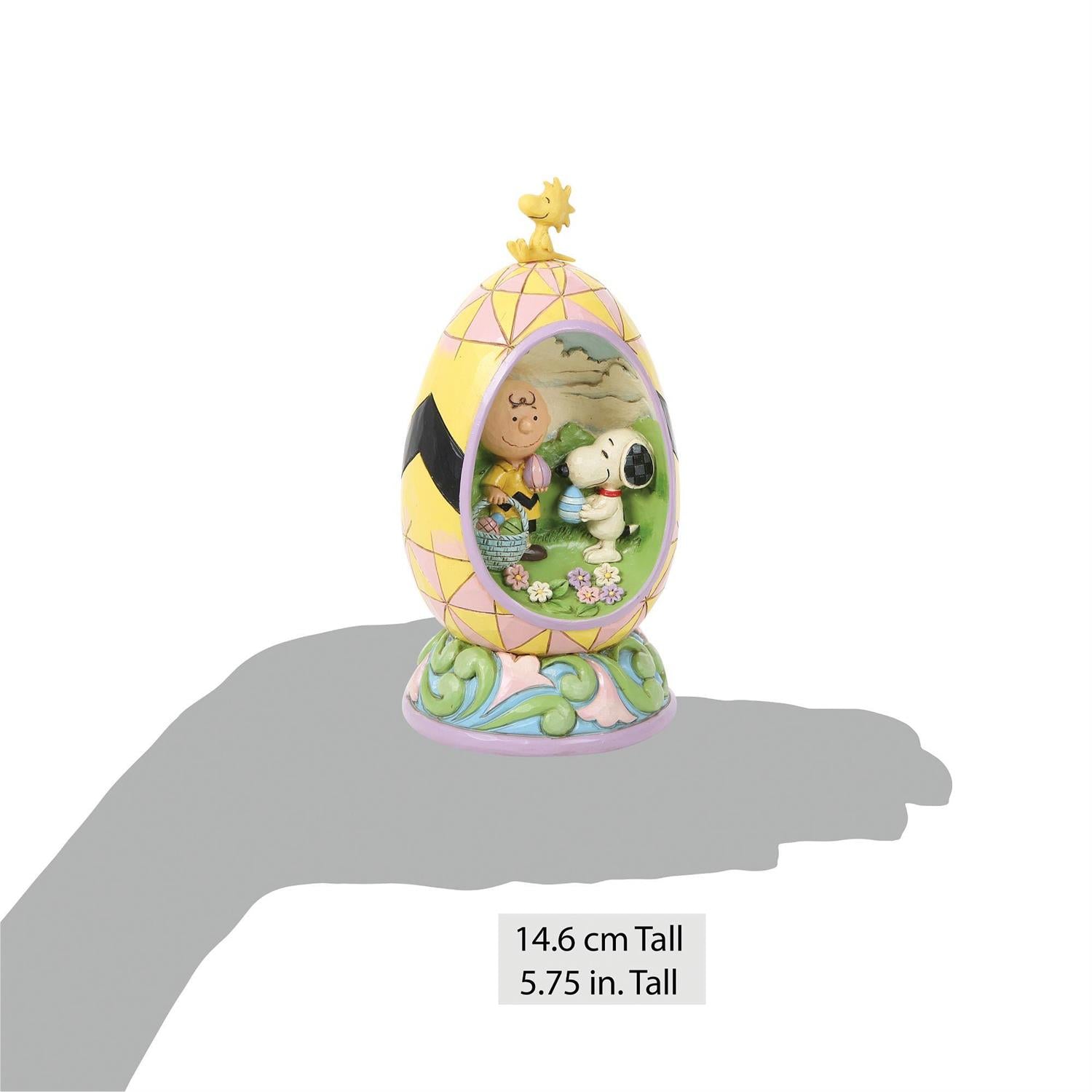 Charlie Brown and Snoopy look for Easter Eggs inside an Easter Egg while Woodstock sits on top