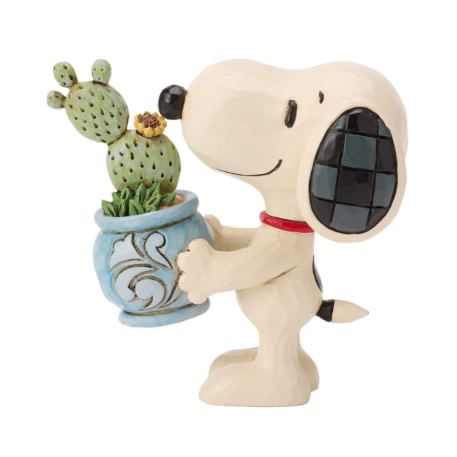 Snoopy holding a Cactus in a Pot 