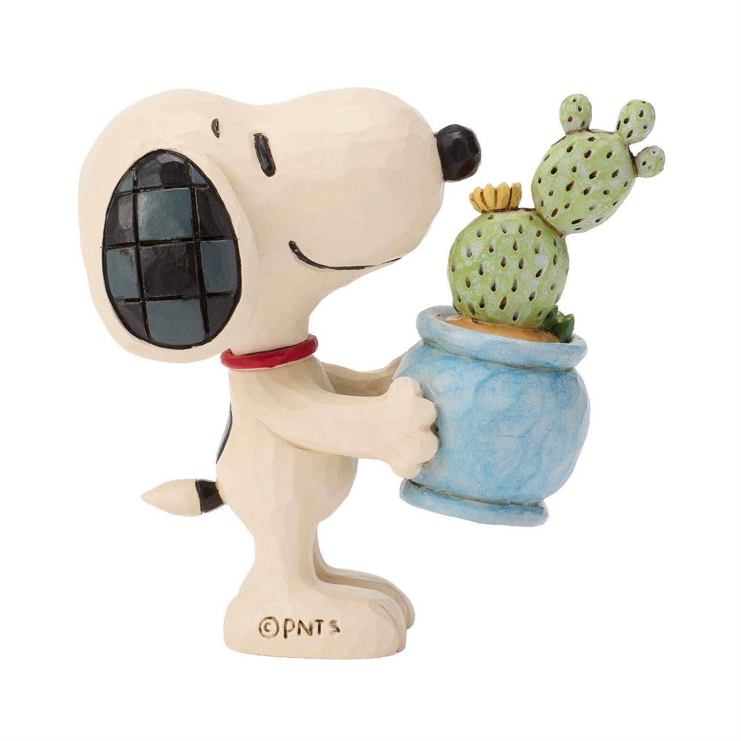 Snoopy holding a Cactus in a Pot 