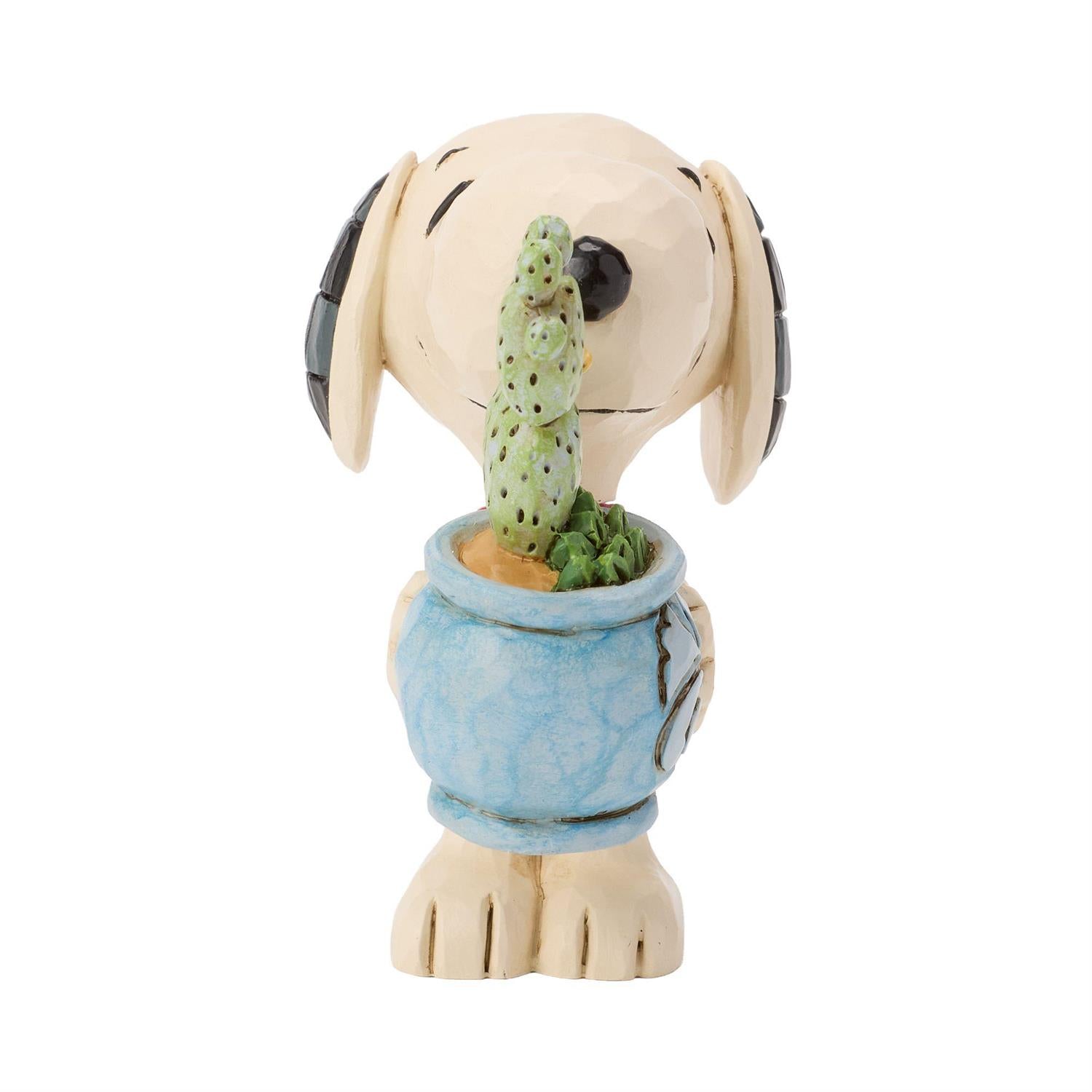 Snoopy holding a Cactus in a Pot 