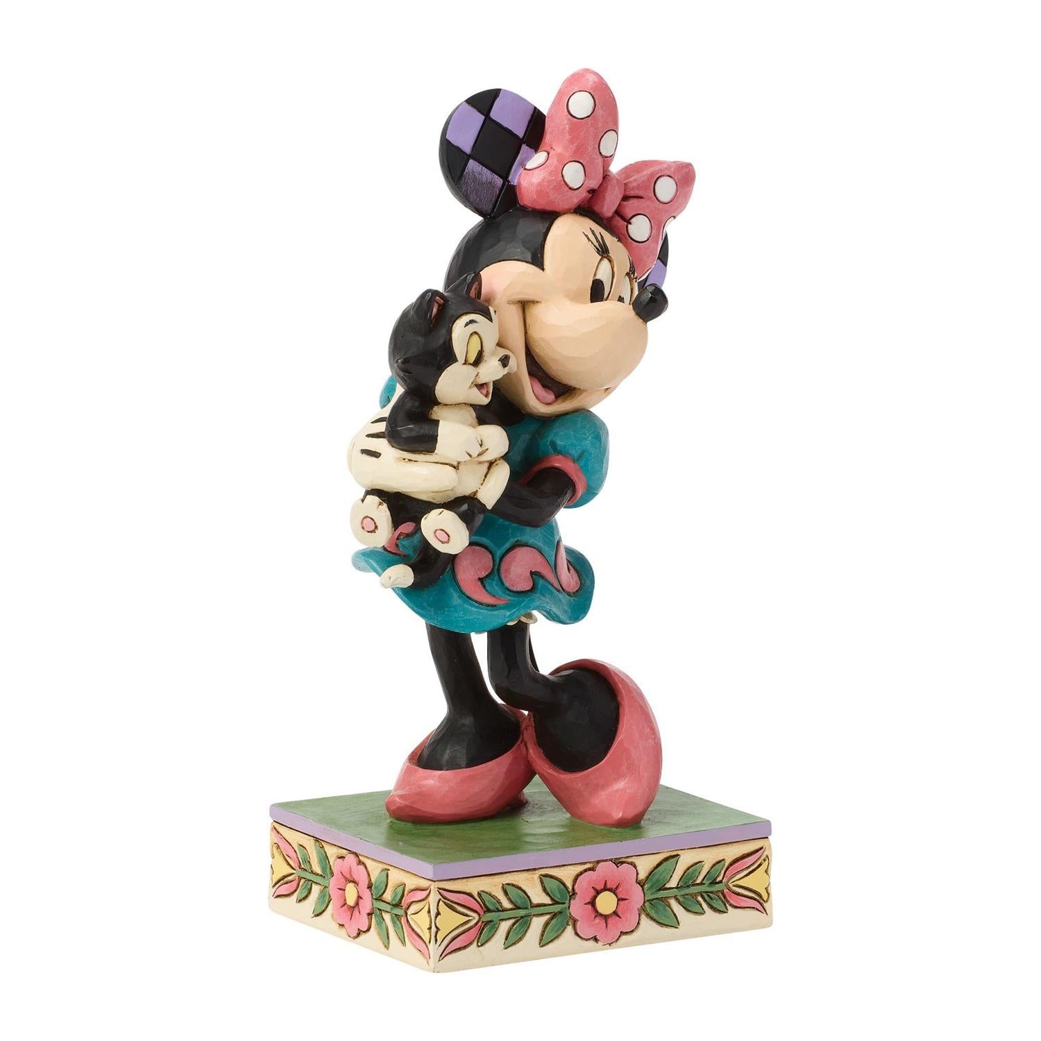 Minnie holding Figaro