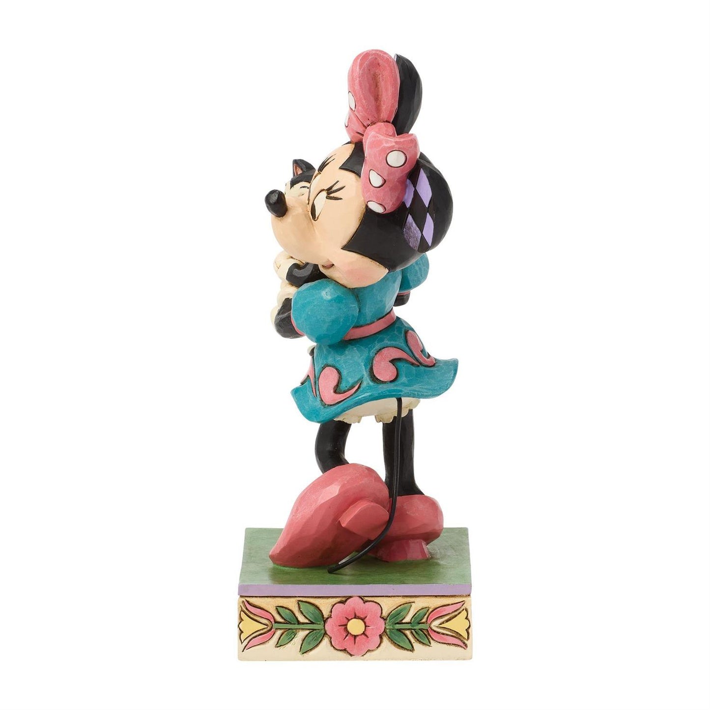 Minnie holding Figaro