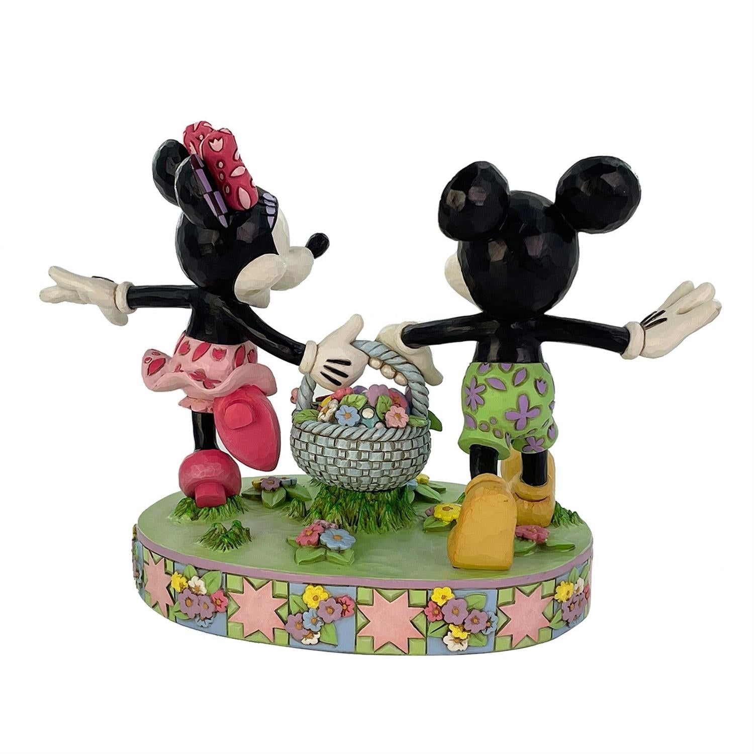 Mickey and Minnie carrying an Easter Basket full of Eggs