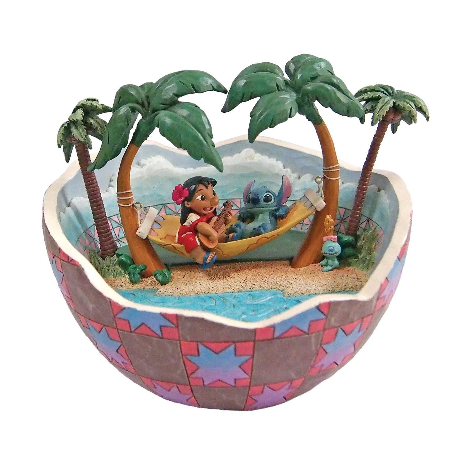 Lilo playing music for Stitch and Scrump inside of a hollowed out Coconut Shell that looks the beach
