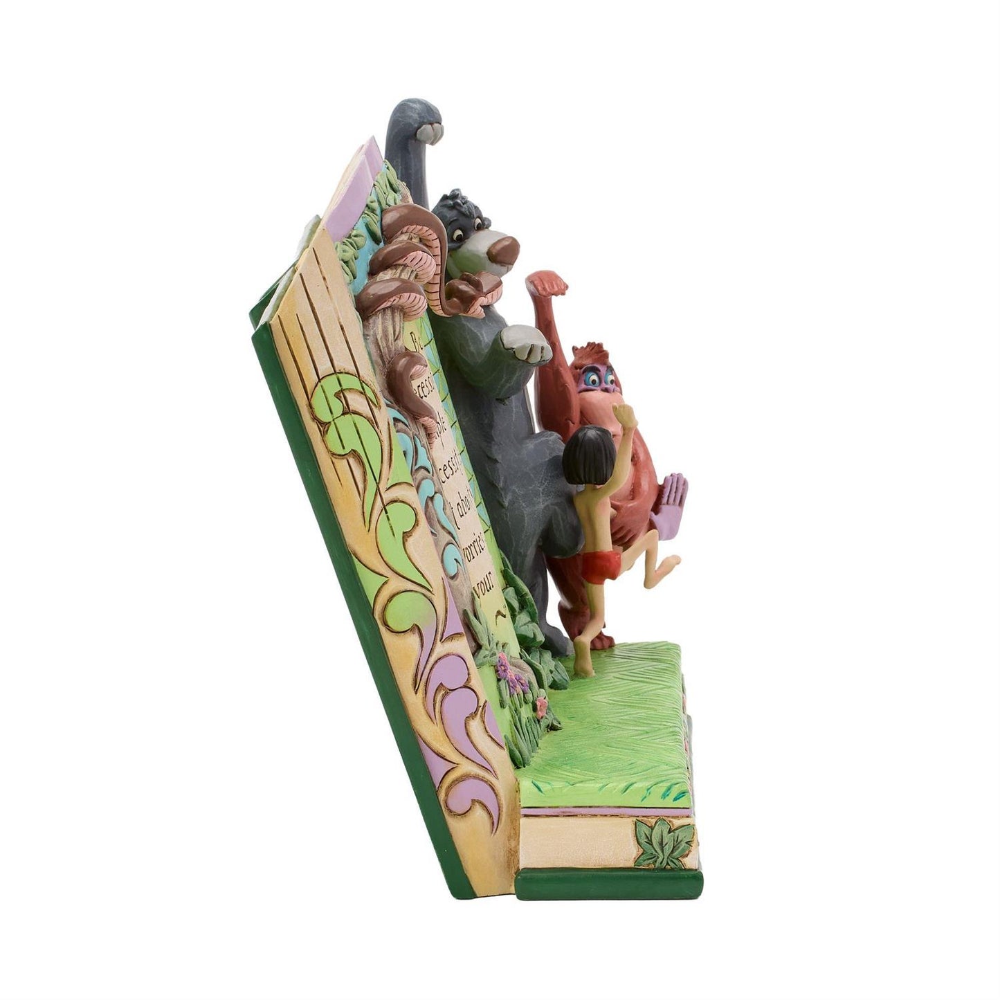 Mowgli, Baloo and King Louie dancing in the forest while Kaa the Python sits on tree branch watching