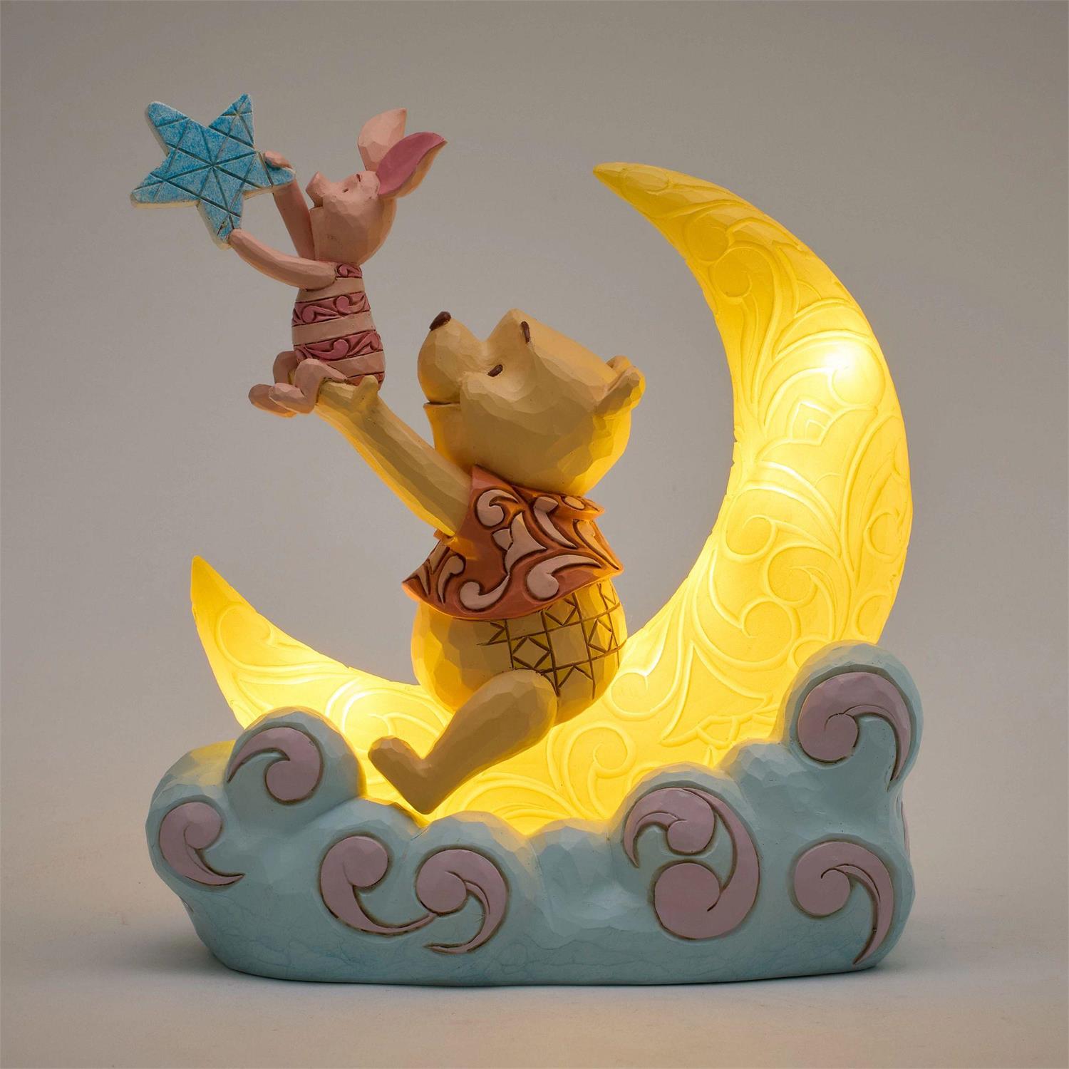 Winnie the Pooh and Piglet sitting on a light up Moon and holding a Glow in the Dark Star