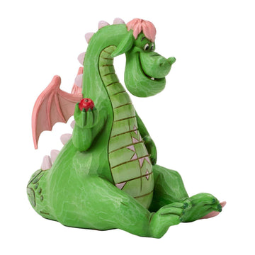 Elliott the Dragon holding an Apple