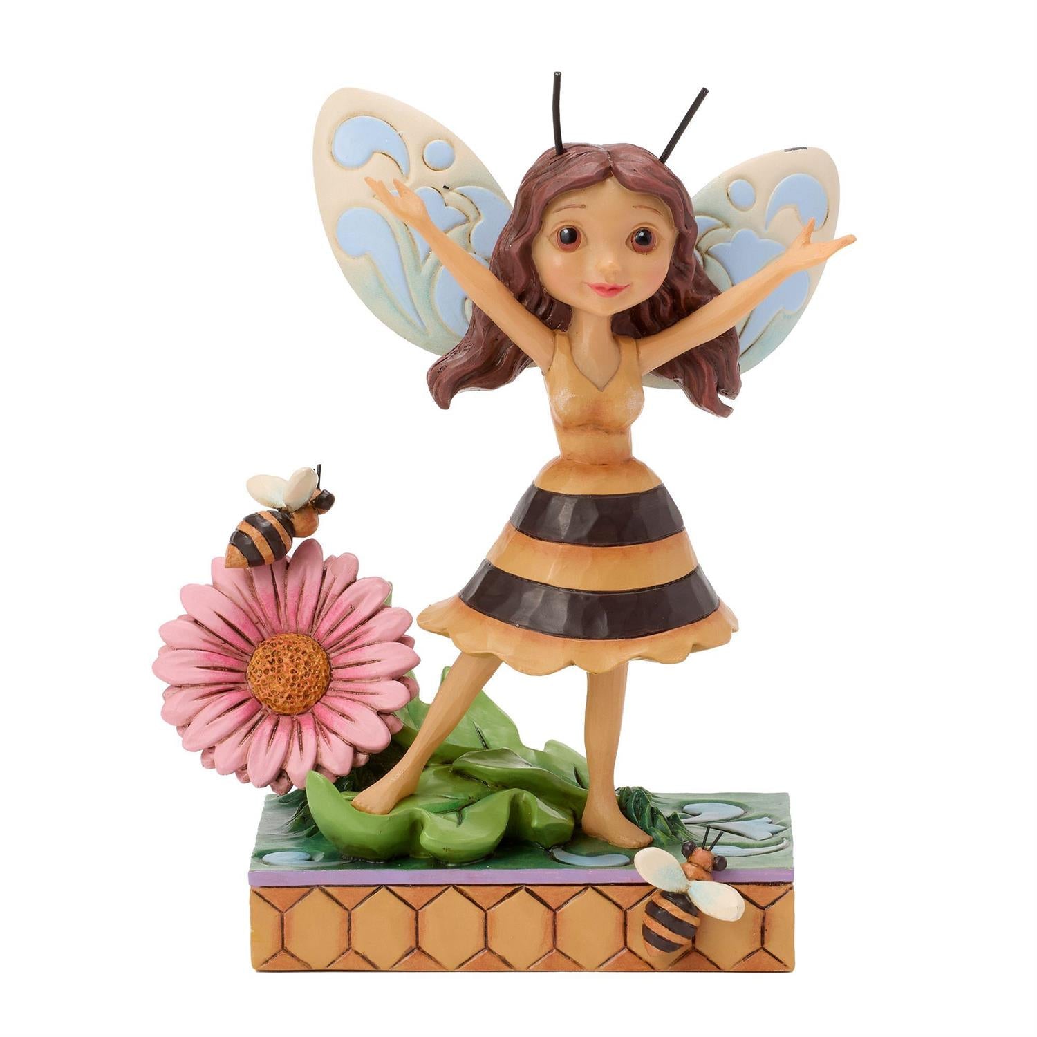 Bumblebee Fairy next to a Pink Flower