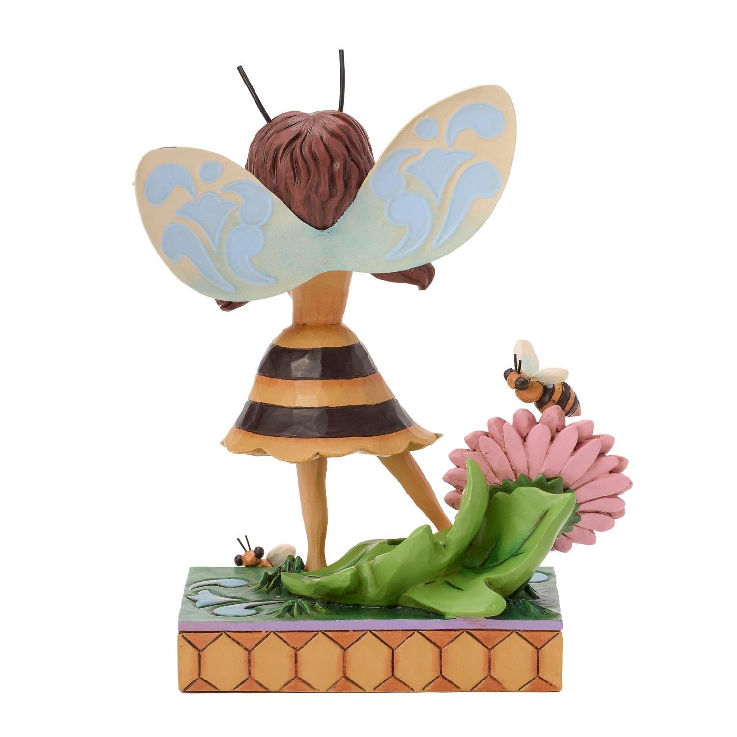 Bumblebee Fairy next to a Pink Flower